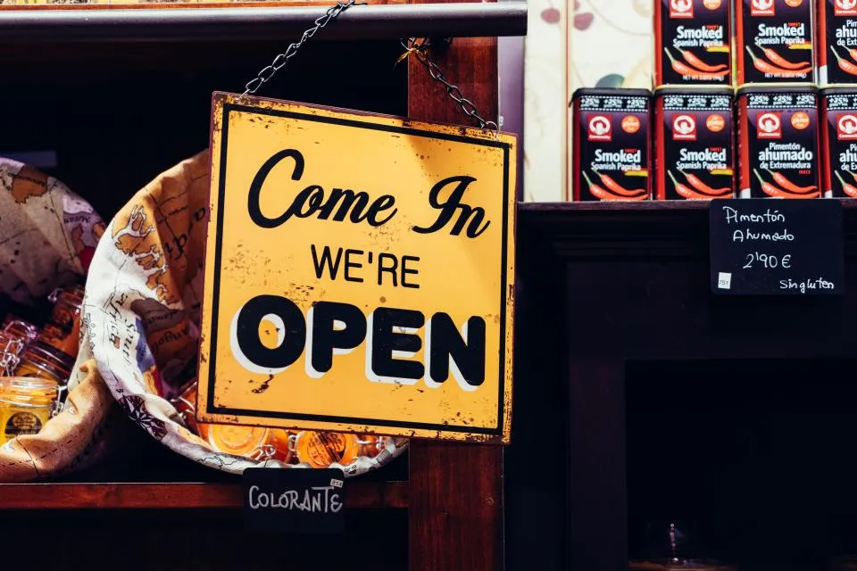 Neon open sign glowing in a shop window