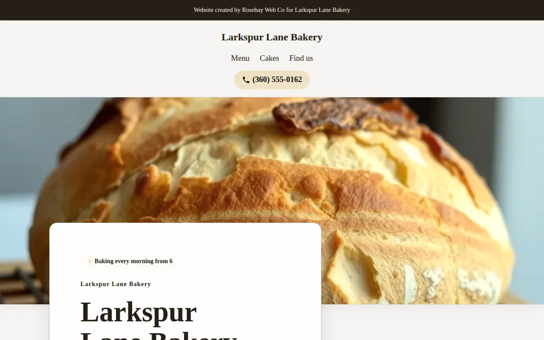 A business website for a fictional bakery, showing fresh bread, menu links, a phone button, and a top bar from a fictional web studio.